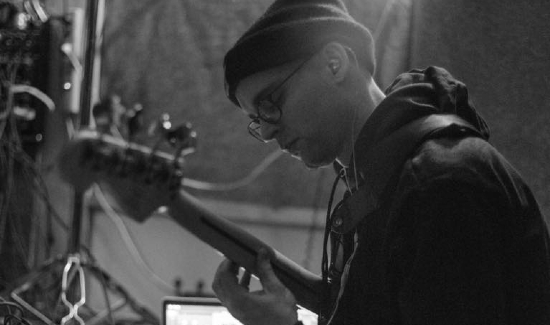 Es-K hip hop producer playing bass